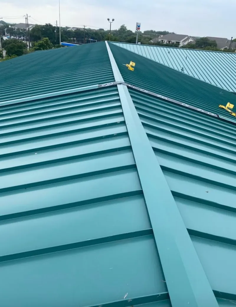 Green commercial metal roof ridge and valley for Metal Roof Repair in Montevallo